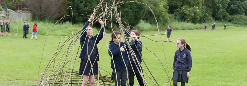 Pupils with willow sticks